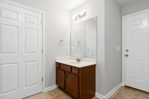 a bathroom with a sink a vanity and a mirror