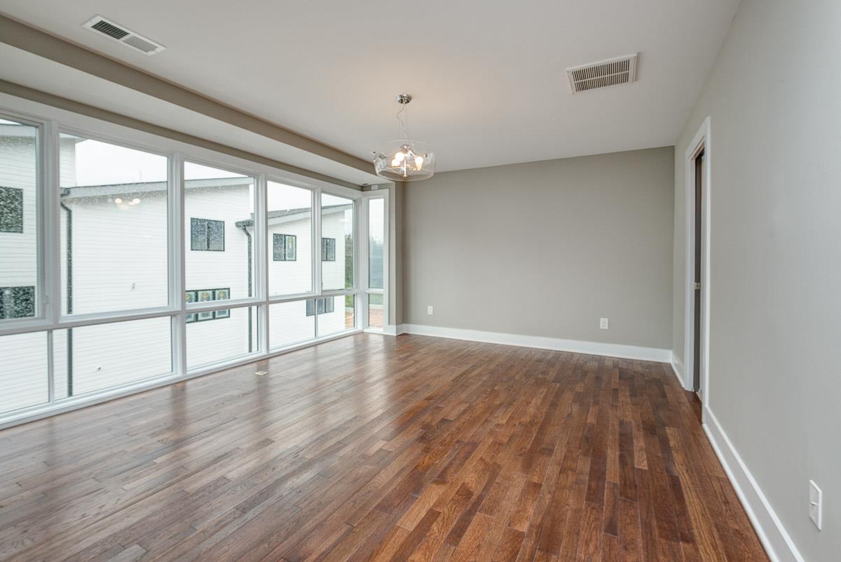 2106 9th Avenue North, Unit 3 Nashville, TN 37228 - Photo 19 of 30 wooden floor in an empty room with a window