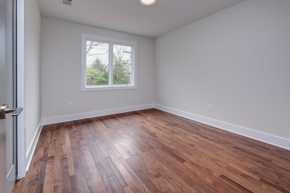 2106 9th Avenue North, Unit 3 Nashville, TN 37228 - Photo 24 of 30 wooden floor in an empty room with a window