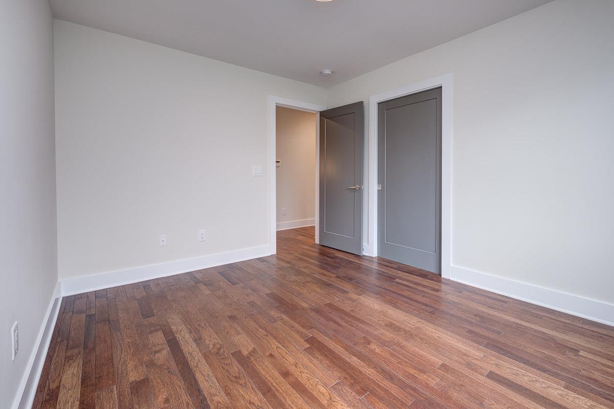 2106 9th Avenue North, Unit 3 Nashville, TN 37228 - Photo 26 of 30 a view of an empty room with wooden floor and closet