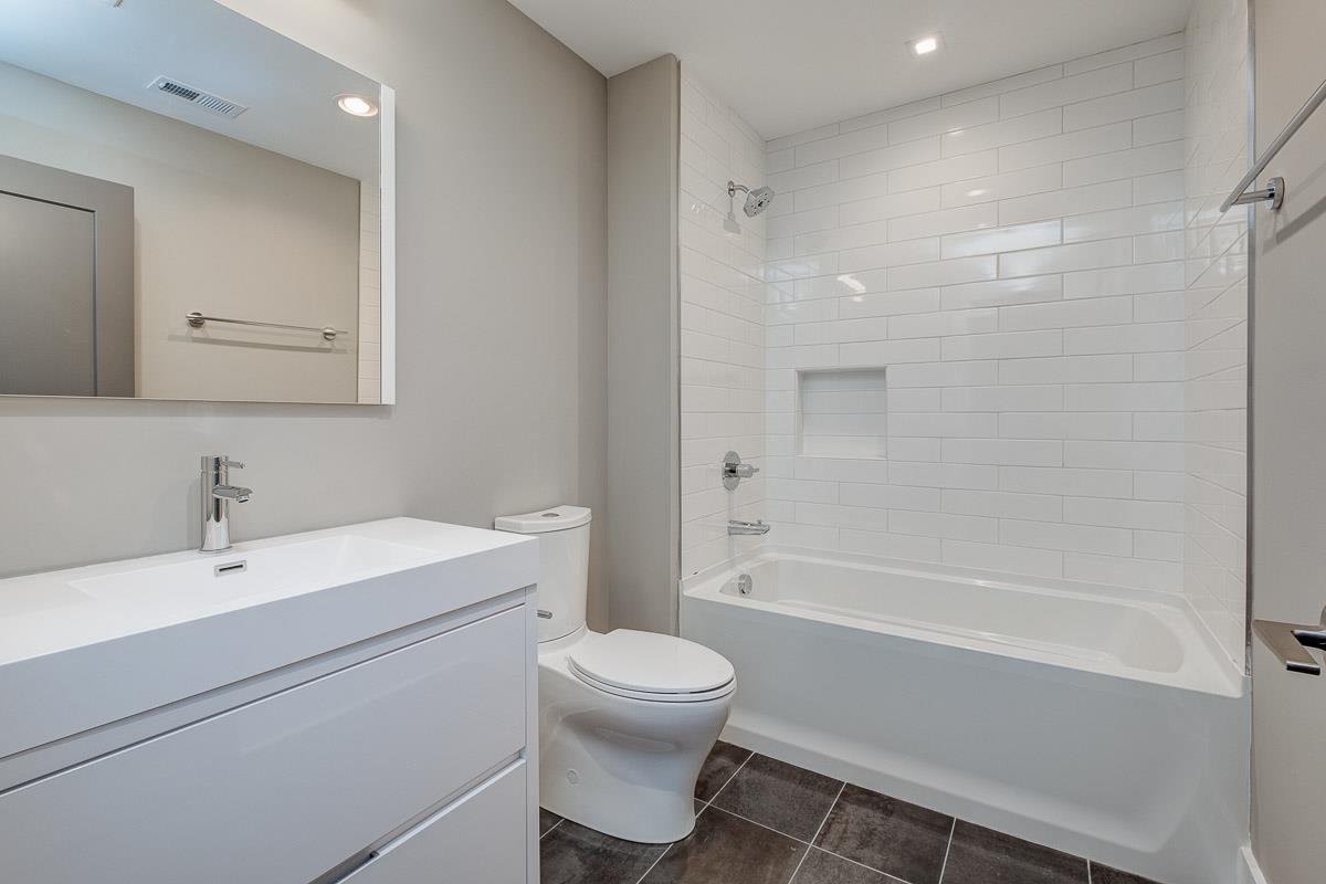 2106 9th Avenue North, Unit 3 Nashville, TN 37228 - Photo 27 of 30 a bathroom with a sink toilet vanity and shower