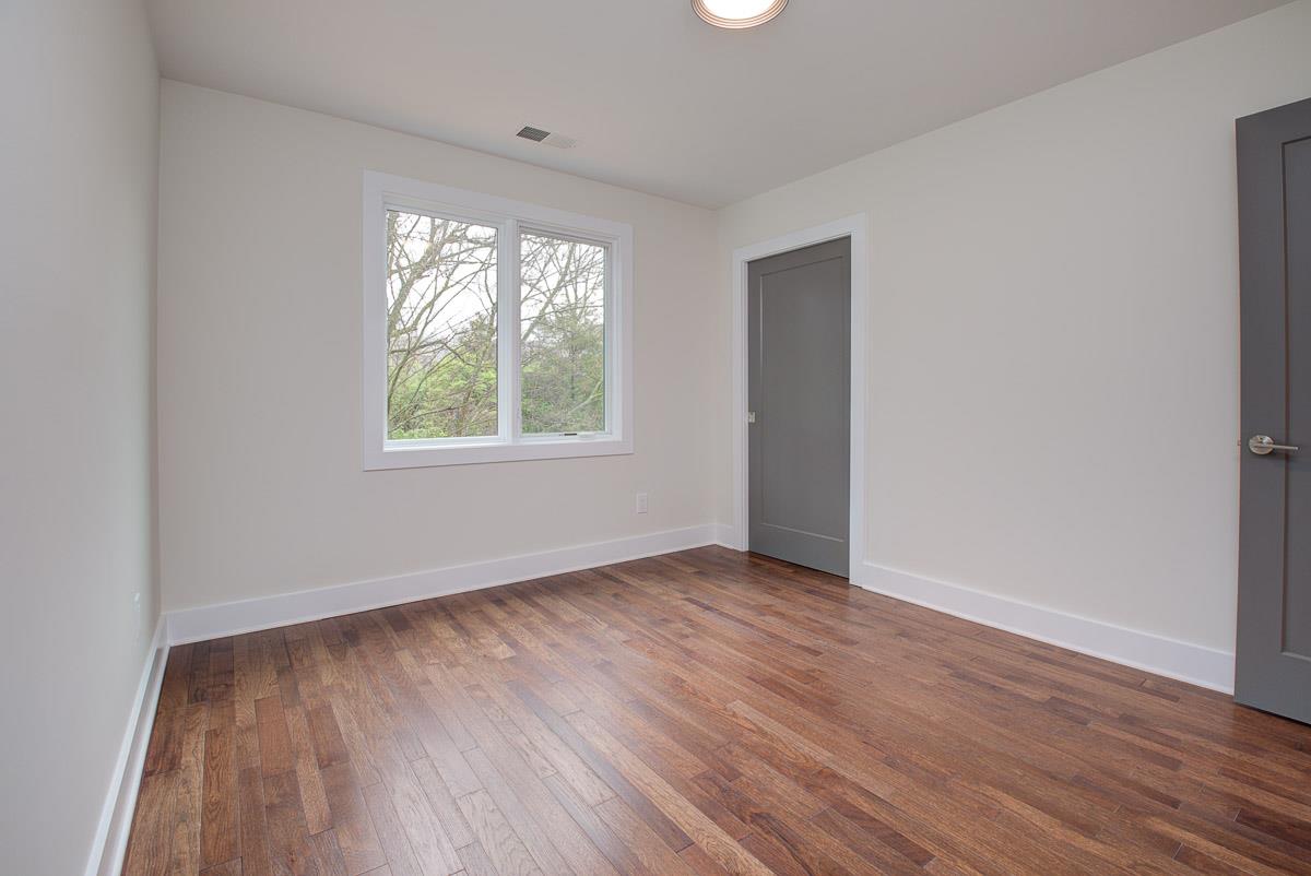 2106 9th Avenue North, Unit 3 Nashville, TN 37228 - Photo 30 of 30 an empty room with wooden floor and windows