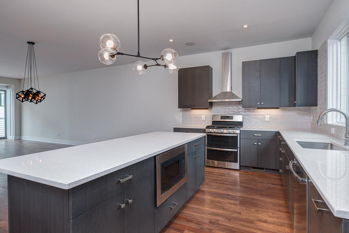 2106 9th Avenue North, Unit 3 Nashville, TN 37228 - Photo 9 of 30 a kitchen with a sink dishwasher a stove and a refrigerator