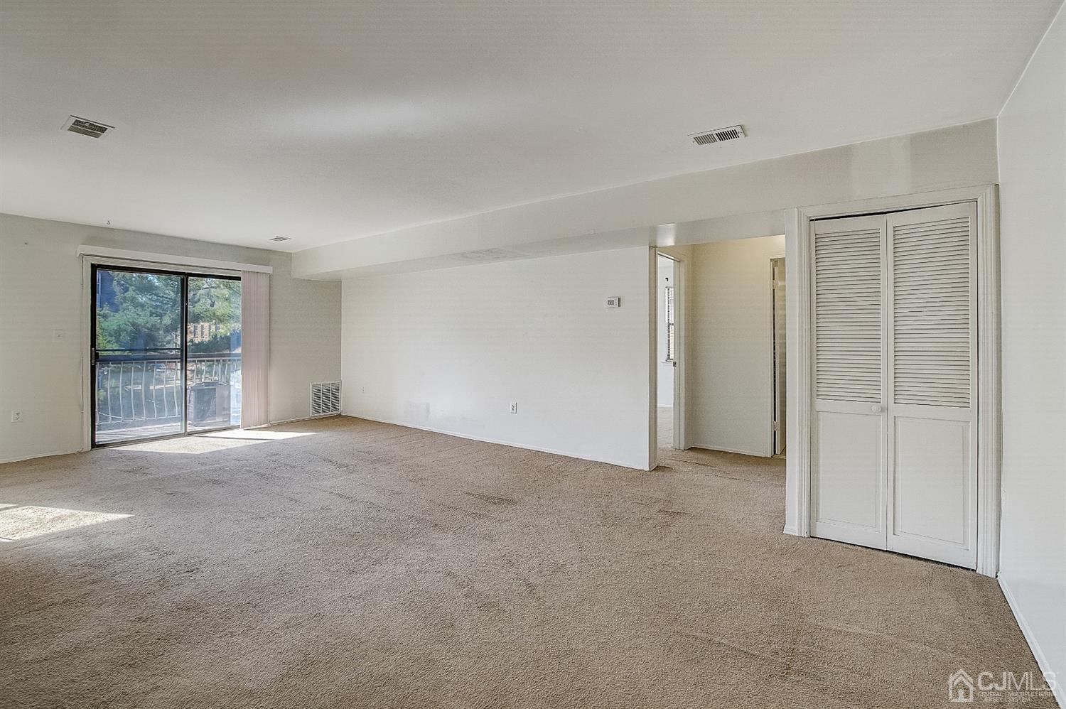 1508 Raspberry Court Edison, NJ 08817 - Photo 2 of 20 an empty room with windows and closet