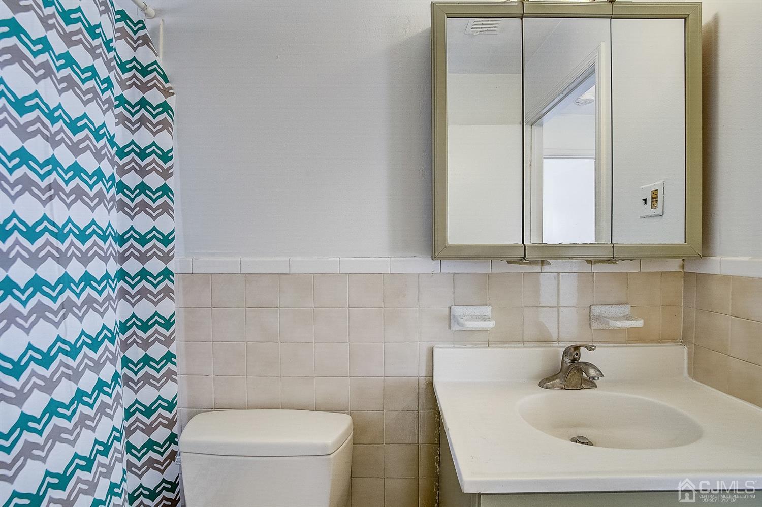 1508 Raspberry Court Edison, NJ 08817 - Photo 14 of 20 a bathroom with a sink toilet and mirror