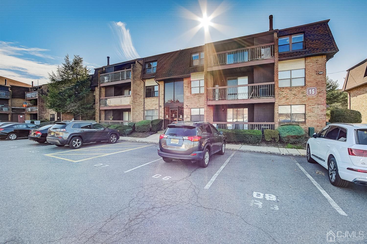 1508 Raspberry Court Edison, NJ 08817 - Photo 16 of 20 a view of a car park in front of a building
