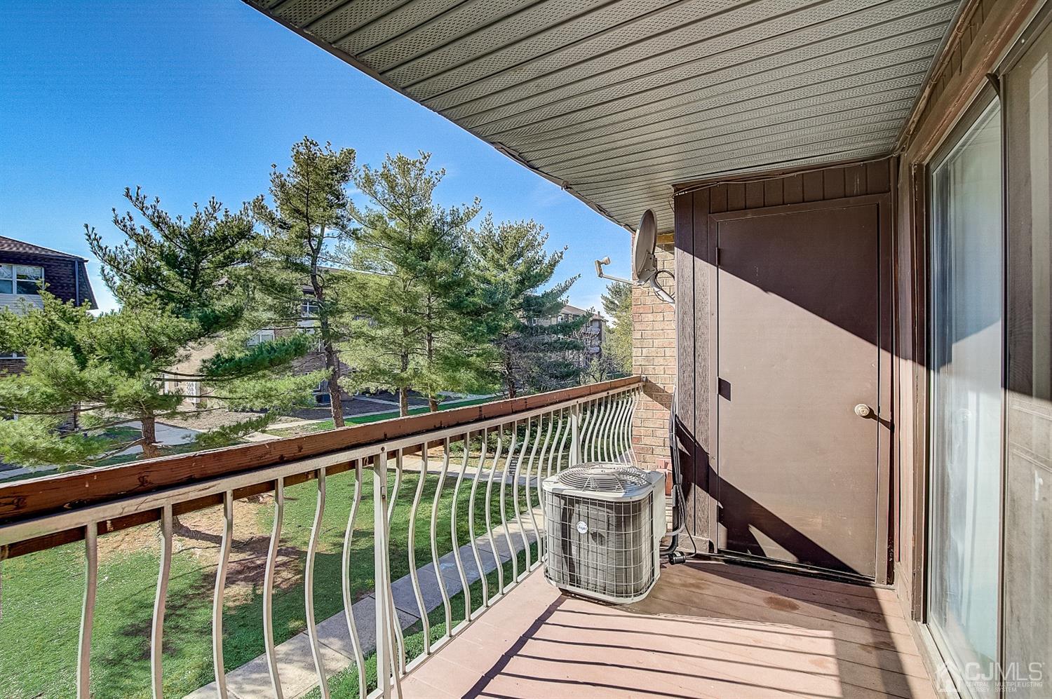 1508 Raspberry Court Edison, NJ 08817 - Photo 3 of 20 a view of a balcony with wooden floor