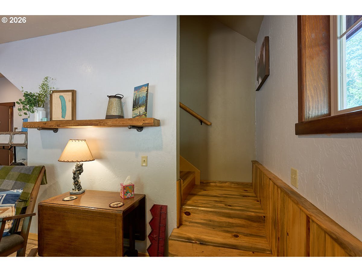 61718 Chief Joseph Loop Road Joseph, OR 97846 - Photo 14 of 38 a bedroom with a bed and a desk