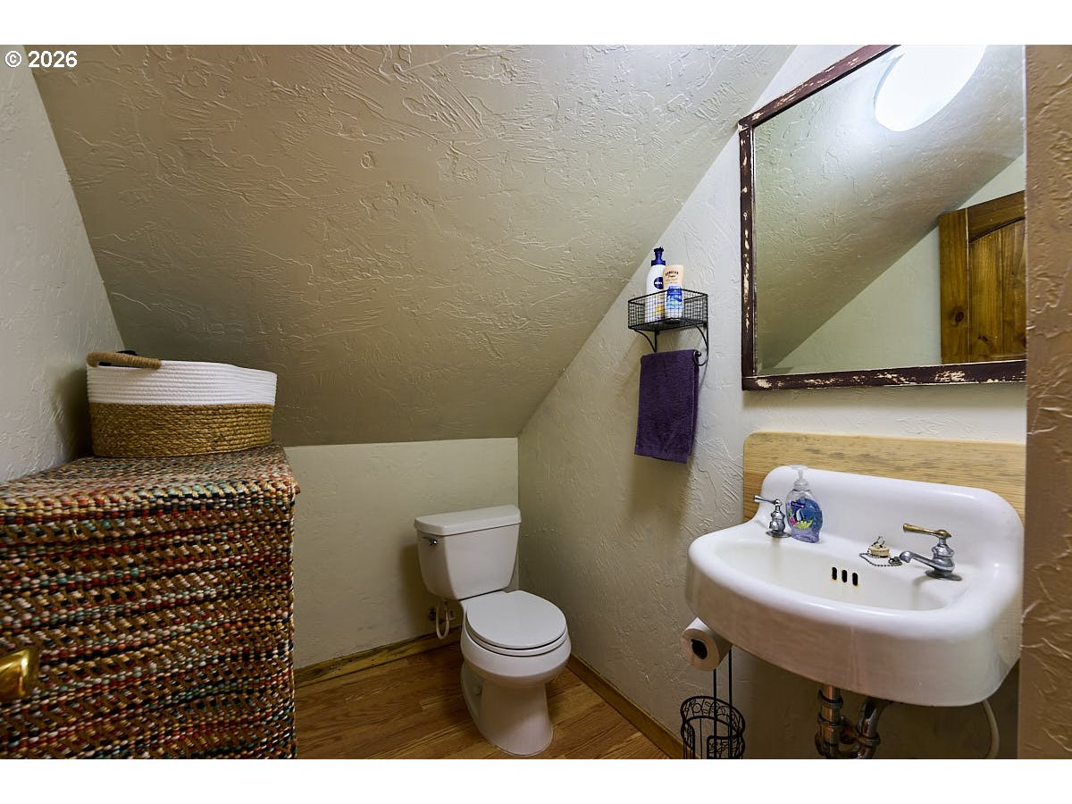 61718 Chief Joseph Loop Road Joseph, OR 97846 - Photo 17 of 38 a bathroom with a sink toilet and mirror