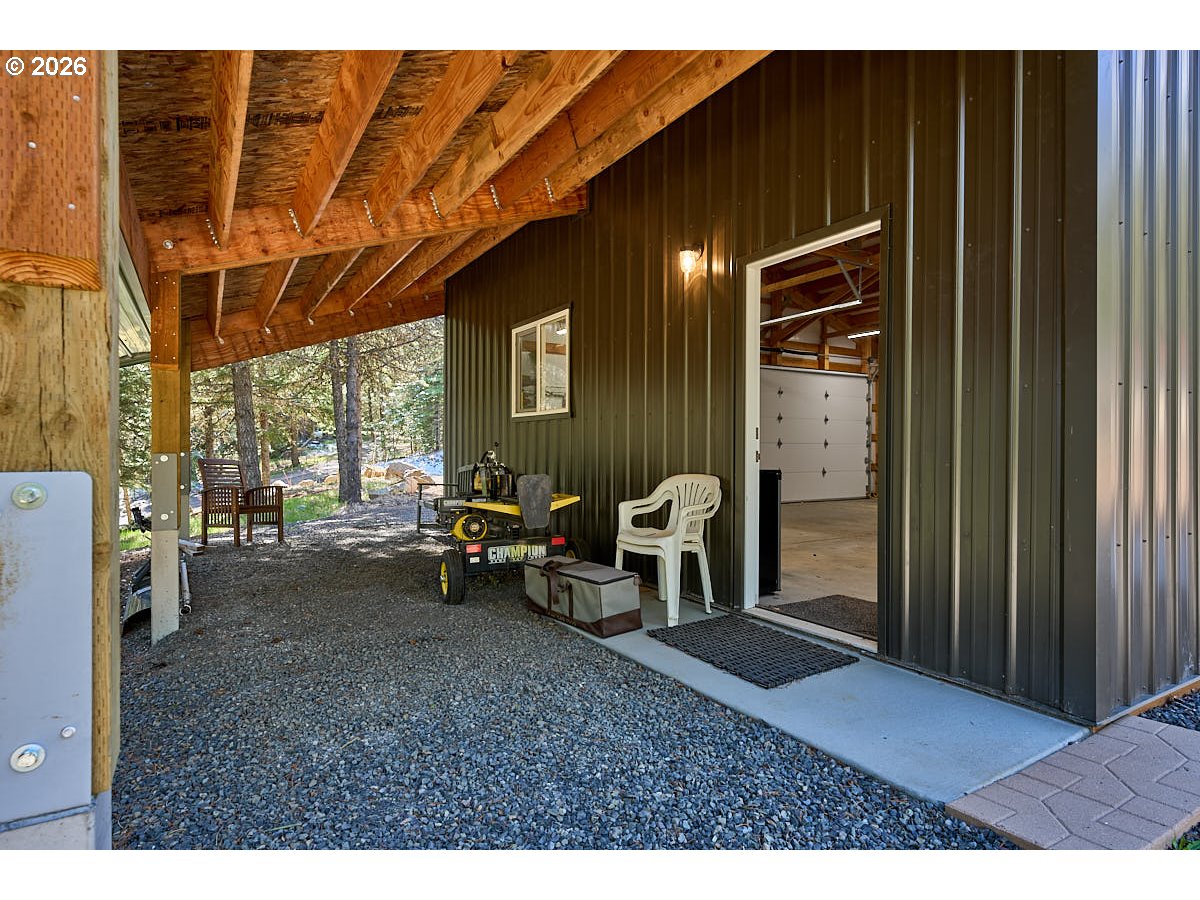 61718 Chief Joseph Loop Road Joseph, OR 97846 - Photo 25 of 38 a backyard of a house with outdoor seating