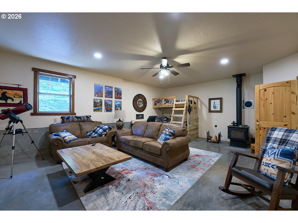61718 Chief Joseph Loop Road Joseph, OR 97846 - Photo 5 of 38 a living room with furniture and a flat screen tv