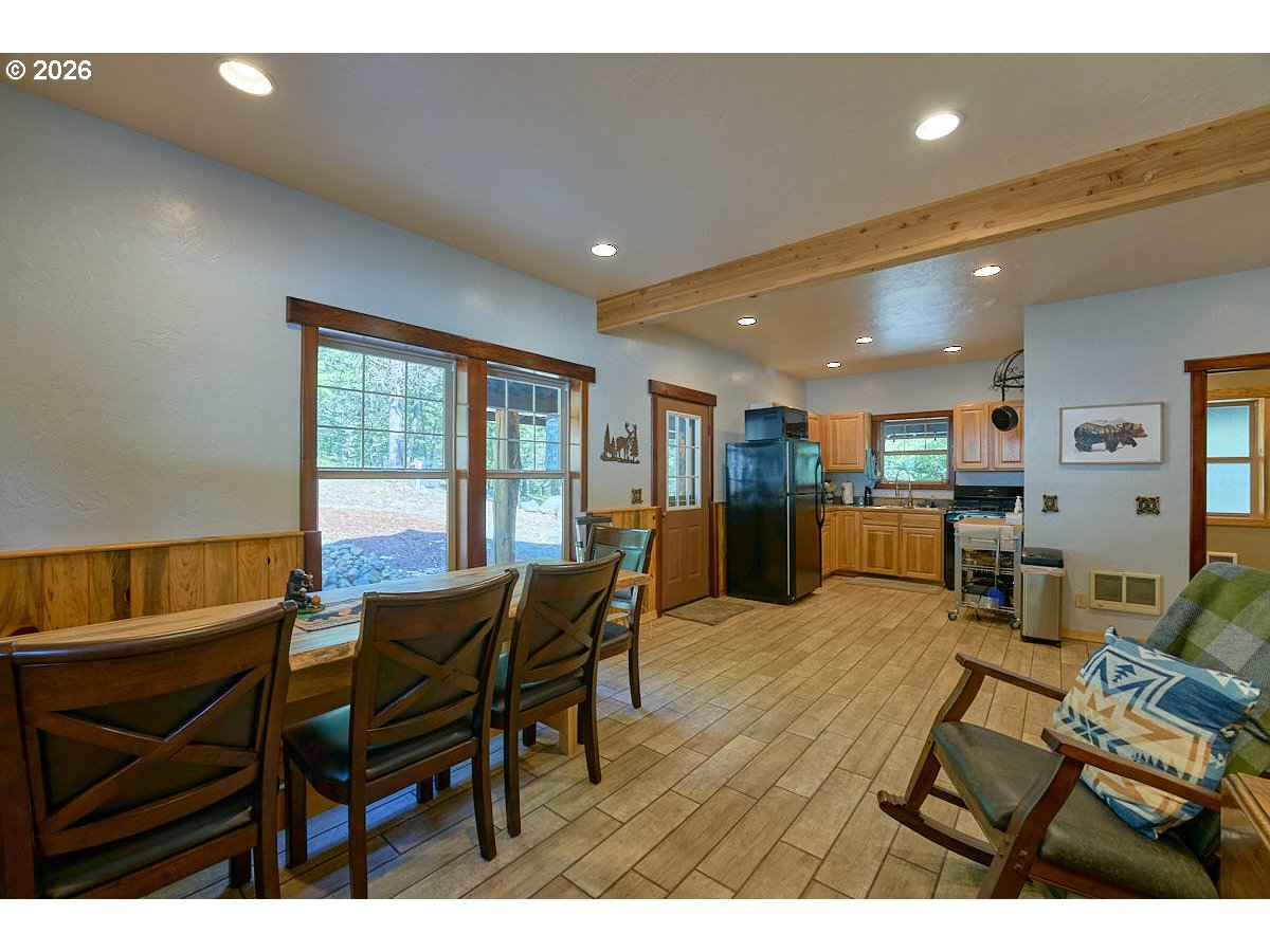 61718 Chief Joseph Loop Road Joseph, OR 97846 - Photo 7 of 38 a view of a dining room with furniture and a potted plant