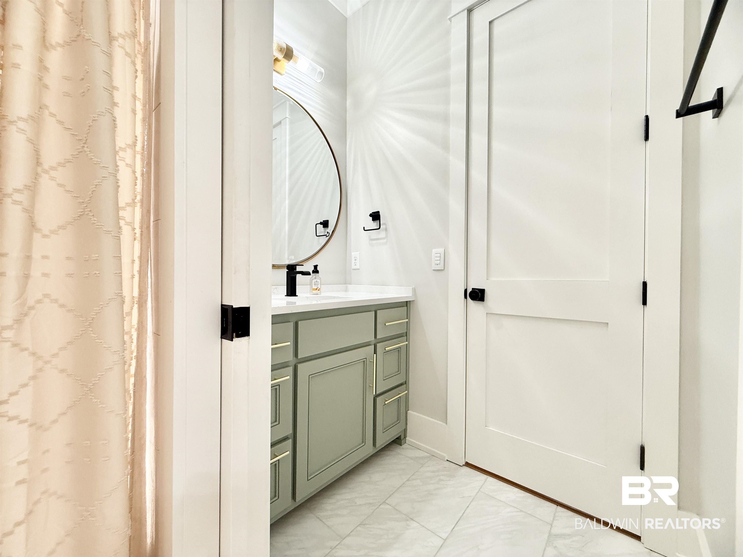 21767 Gallery Boulevard Fairhope, AL 36532 - Photo 45 of 74 Full bathroom featuring marble look tiles, vanity, and a shower with shower curtain