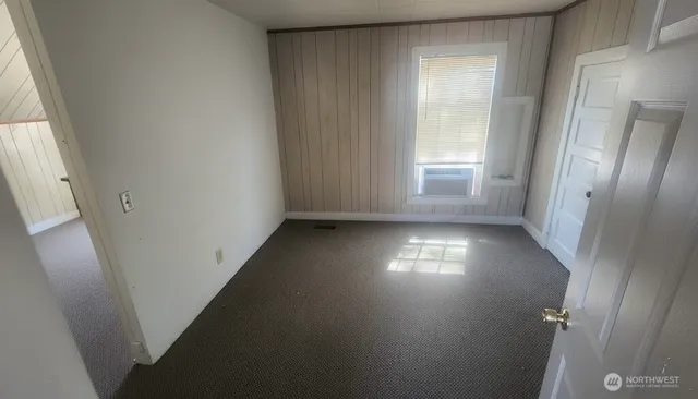 a kitchen with white cabinets and a sink