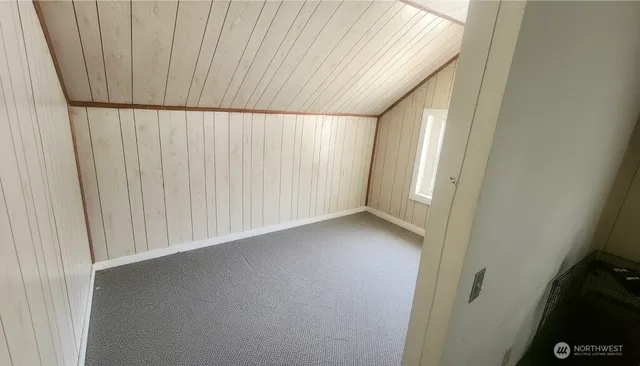 a view of washer and dryer with kitchen in the background