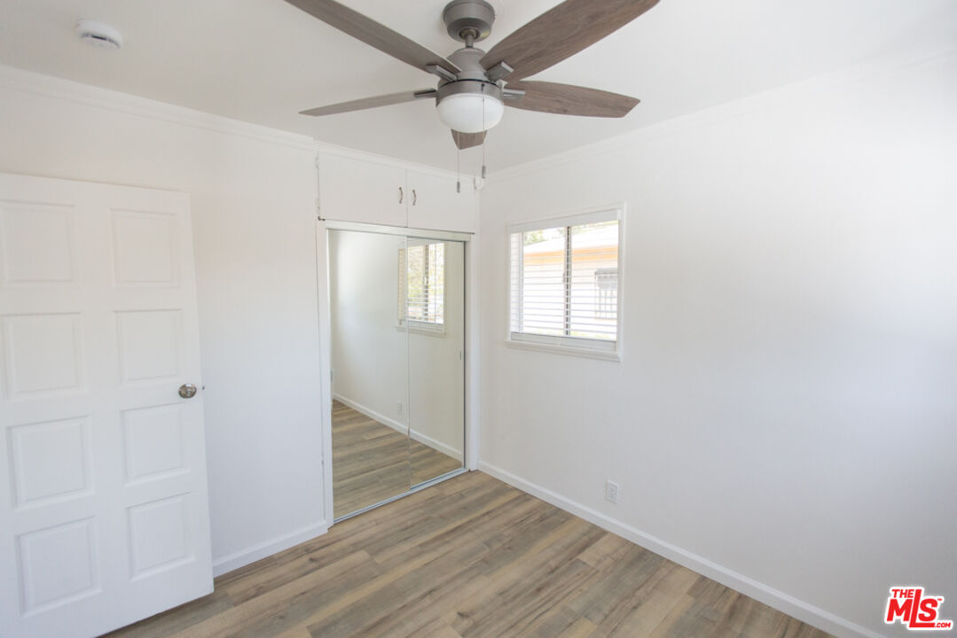5267 Ithaca Avenue Los Angeles, CA 90032 - Photo 14 of 25 wooden floor in an empty room with a window