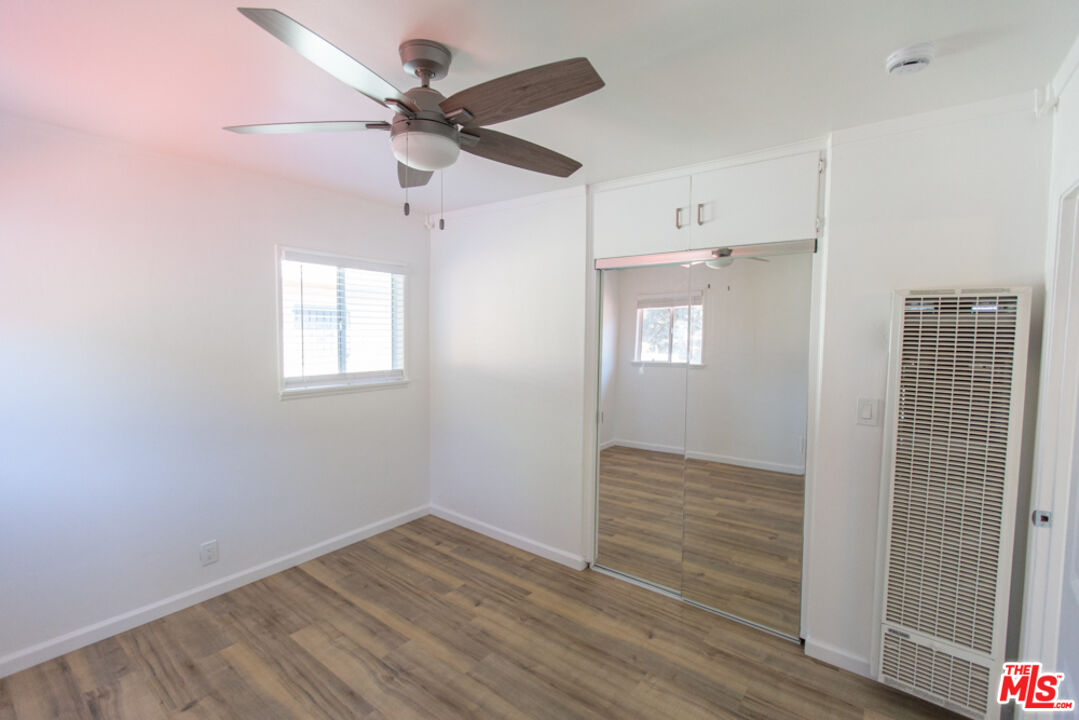 5267 Ithaca Avenue Los Angeles, CA 90032 - Photo 15 of 25 wooden floor in an empty room with a window