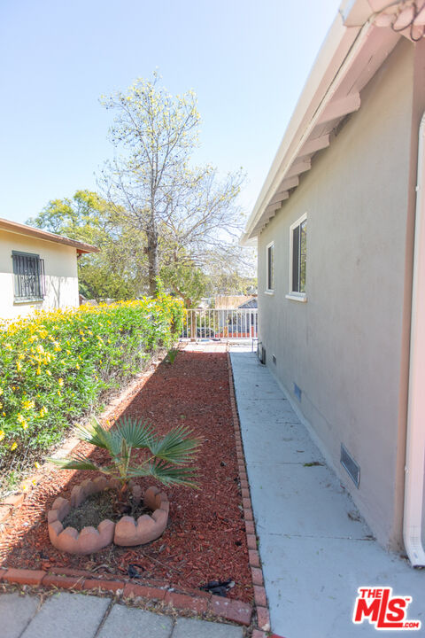 5267 Ithaca Avenue Los Angeles, CA 90032 - Photo 21 of 25 a view of a house with a yard