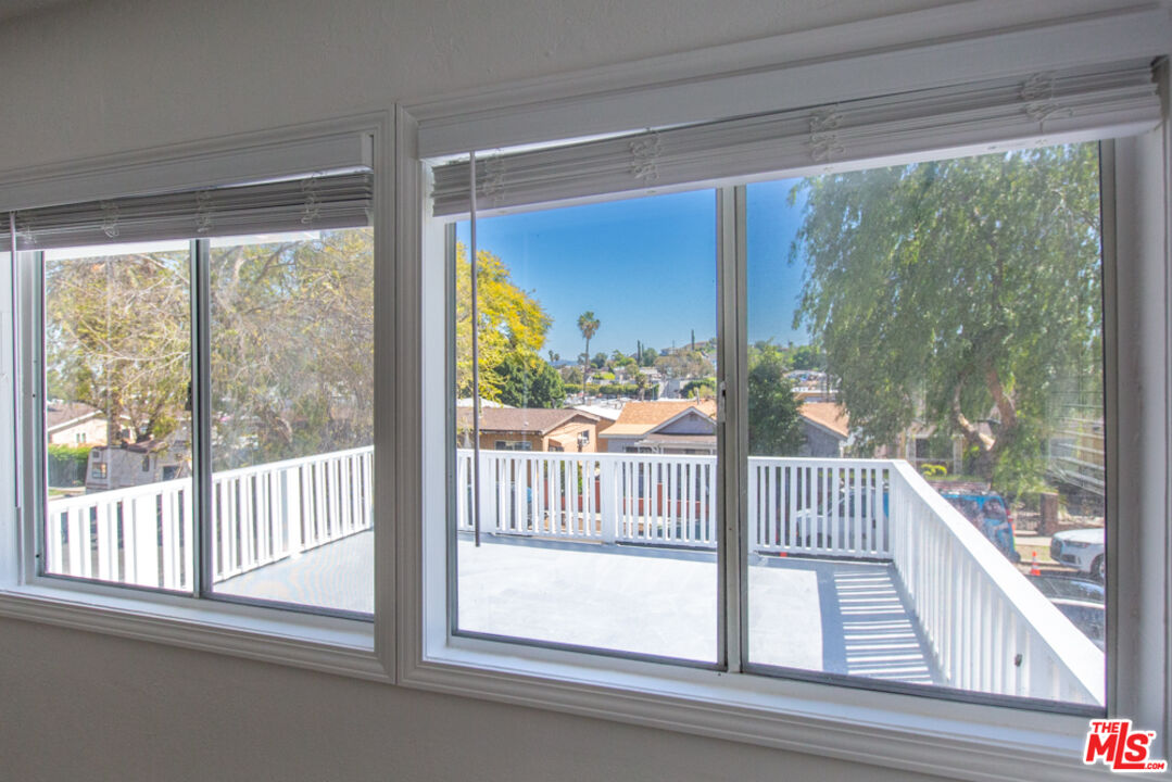 5267 Ithaca Avenue Los Angeles, CA 90032 - Photo 6 of 25 a view of a glass door and deck