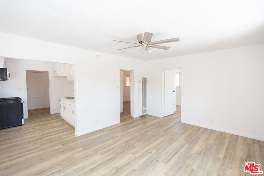 5267 Ithaca Avenue Los Angeles, CA 90032 - Photo 8 of 25 a view of an empty room with wooden floor