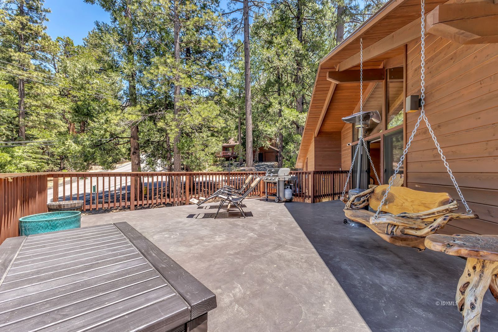 24924 Fern Valley Road Idyllwild, CA 92549 - Photo 24 of 72 a view of a deck with chairs and wooden fence