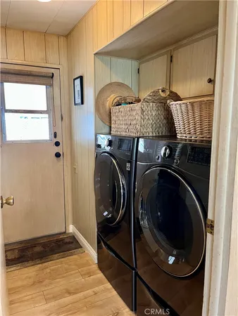 a close view of a sink and cabinets in a room