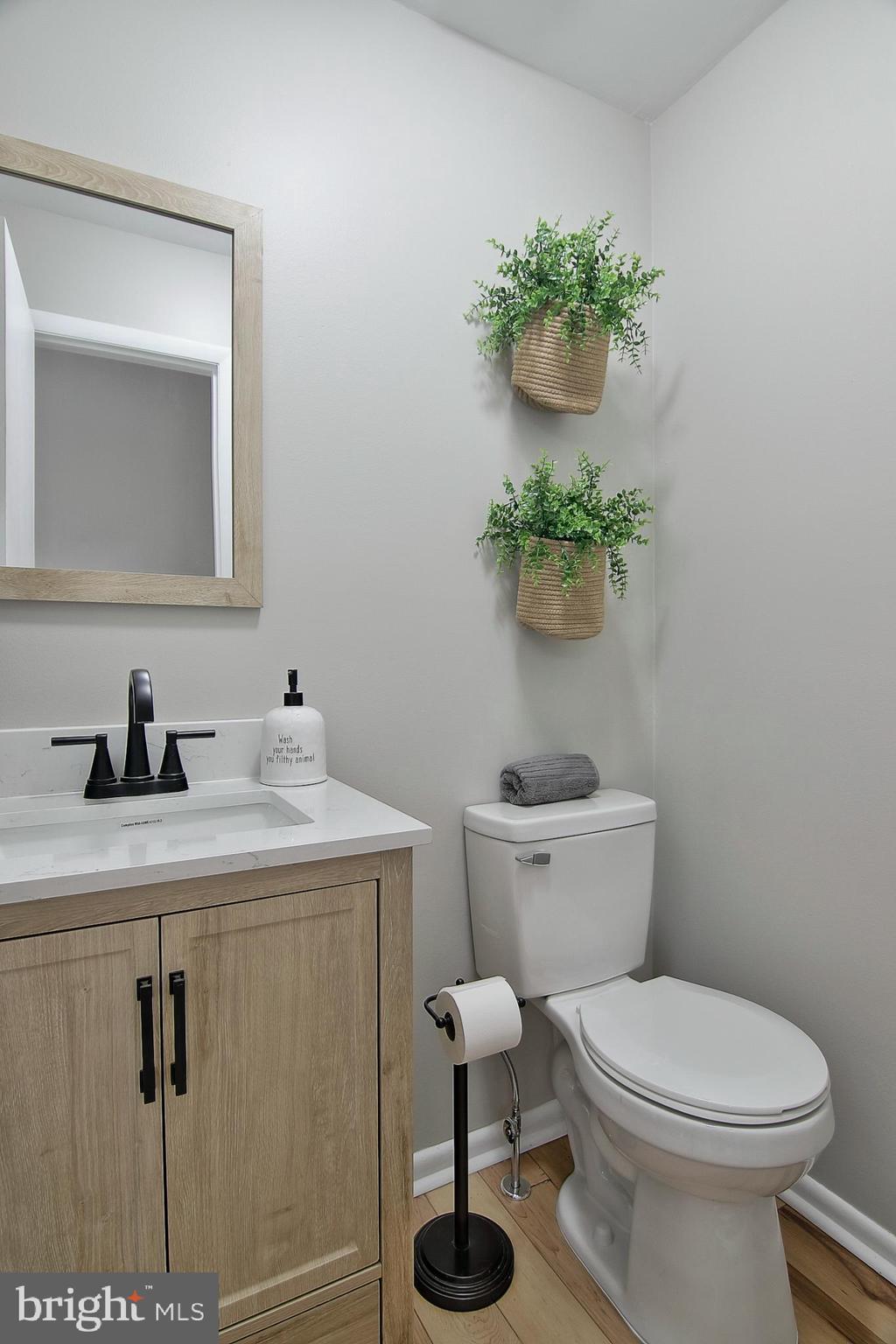 2705 Walnut Ridge Drive Pottstown, PA 19464 - Photo 12 of 27 a bathroom with a toilet sink and mirror