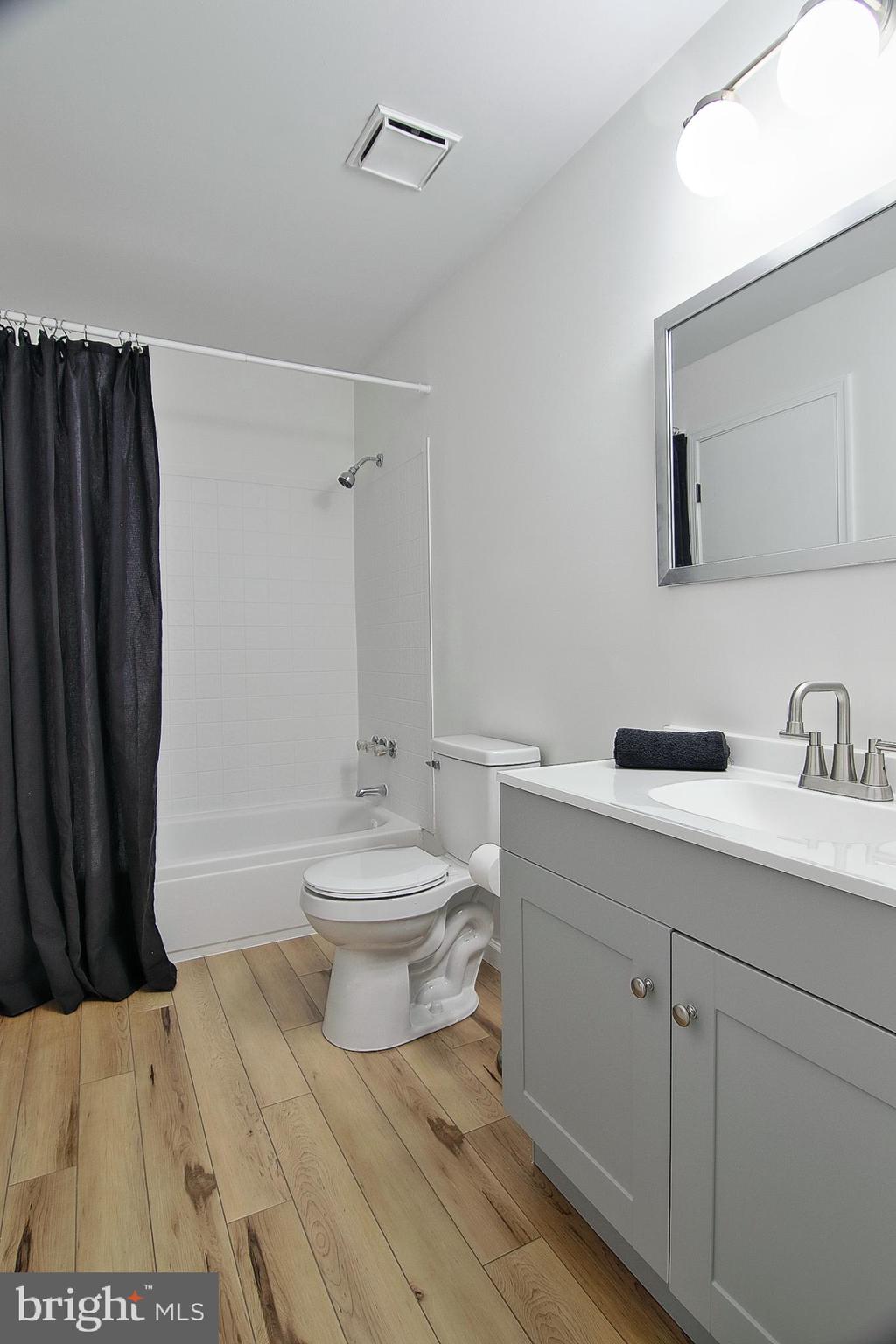 2705 Walnut Ridge Drive Pottstown, PA 19464 - Photo 19 of 27 a bathroom with a sink a toilet and shower