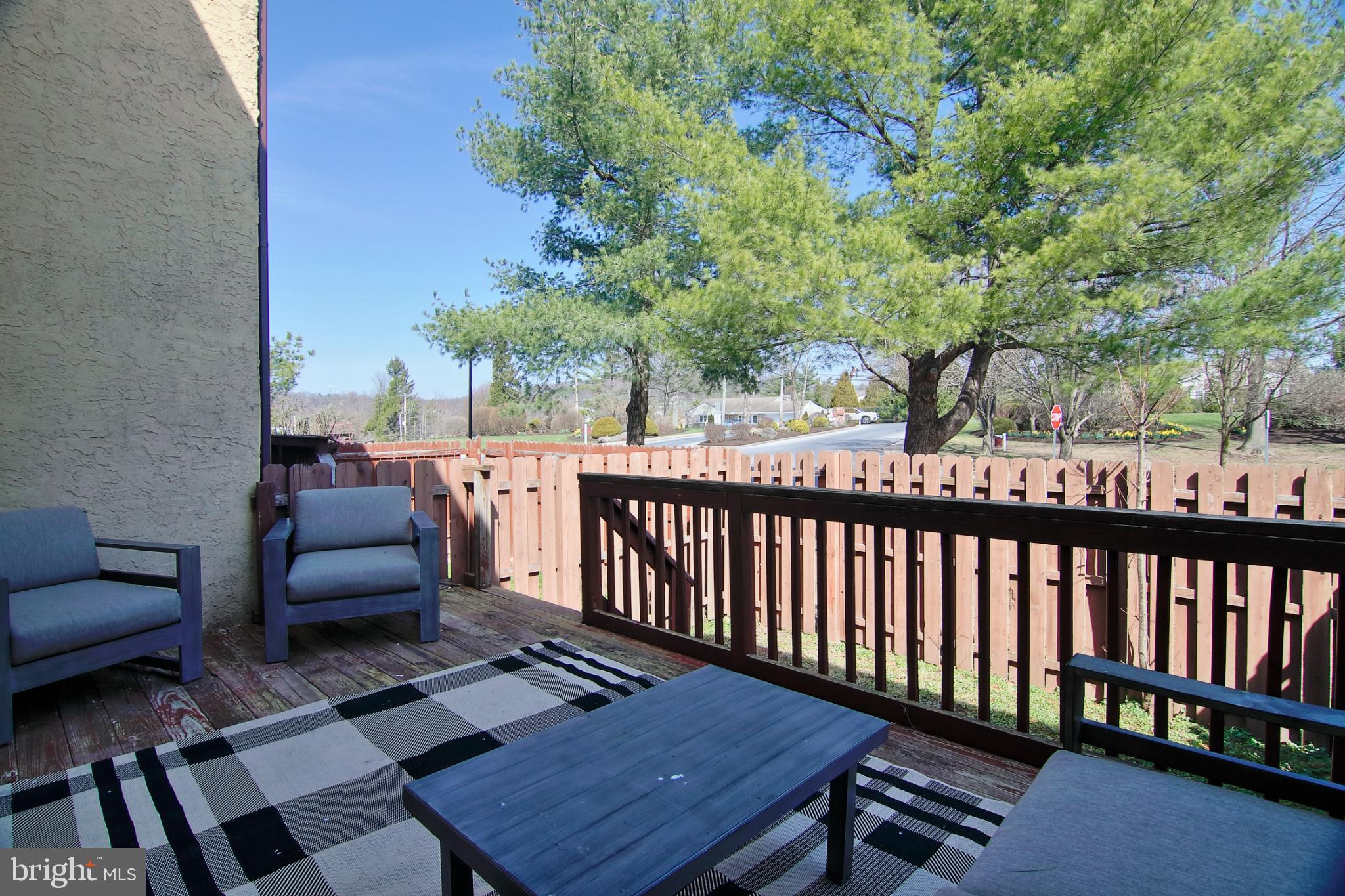 2705 Walnut Ridge Drive Pottstown, PA 19464 - Photo 27 of 27 a balcony with wooden floor and outdoor seating