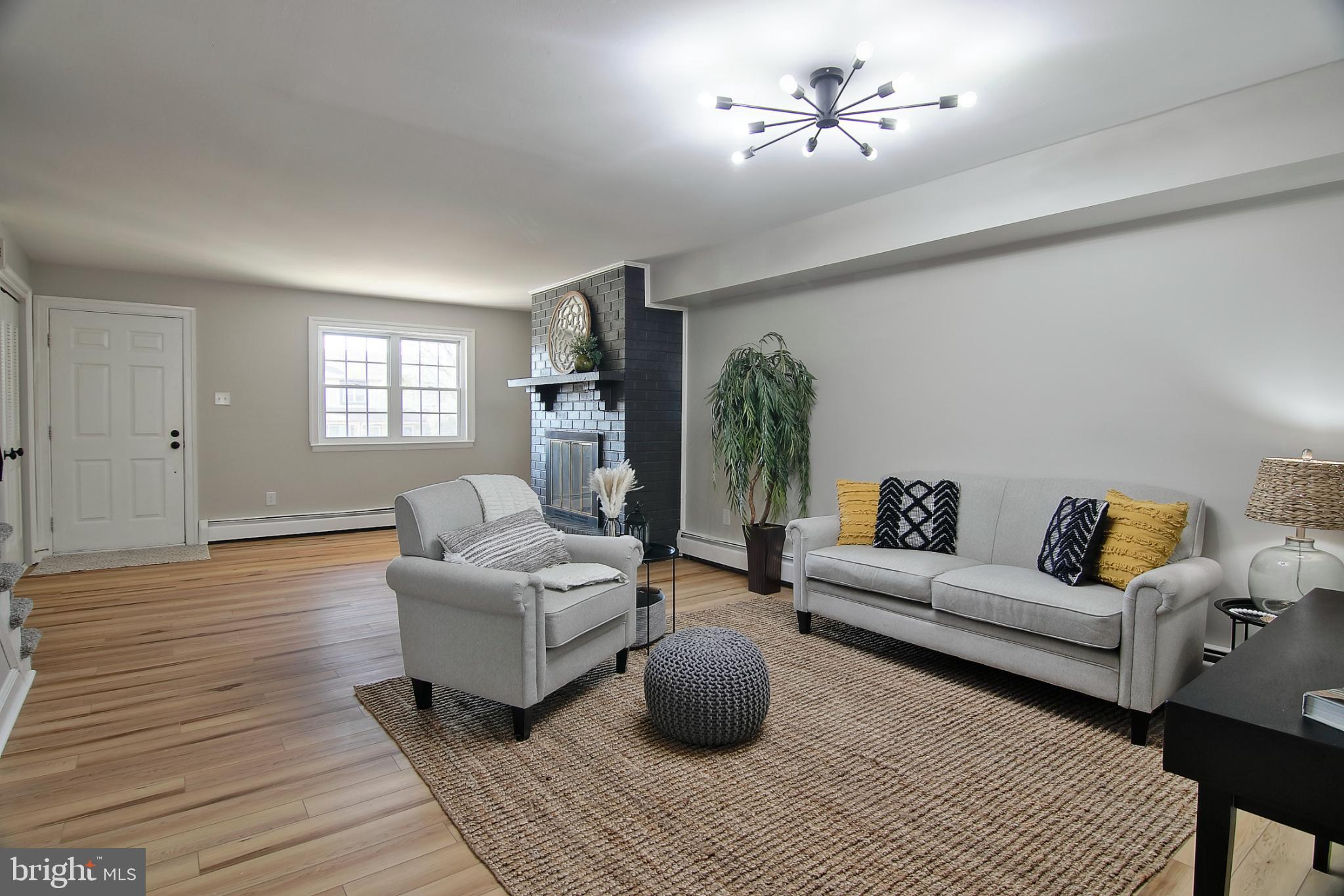 2705 Walnut Ridge Drive Pottstown, PA 19464 - Photo 3 of 27 a living room with furniture and a chandelier