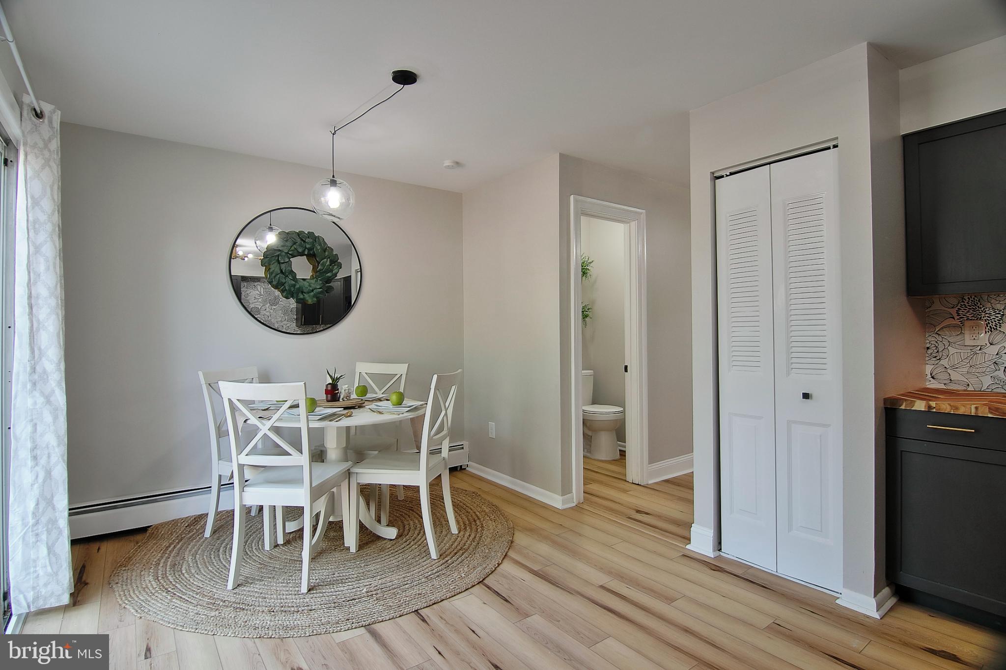 2705 Walnut Ridge Drive Pottstown, PA 19464 - Photo 5 of 27 a view of a dining room with furniture wooden floor and a chandelier