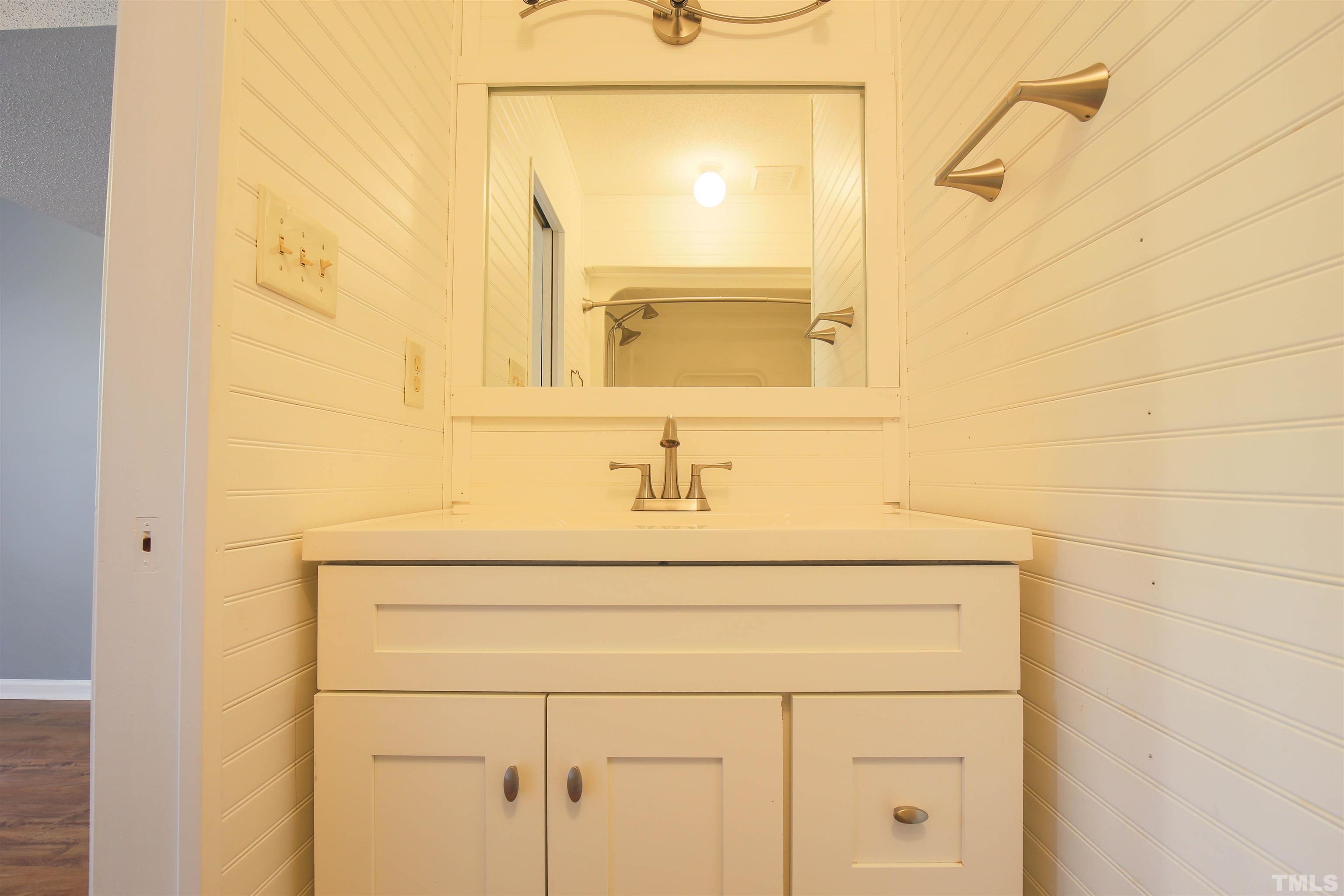 1507 Clermont Road, Unit T23 Durham, NC 27713 - Photo 18 of 24 a bathroom with a sink and a mirror