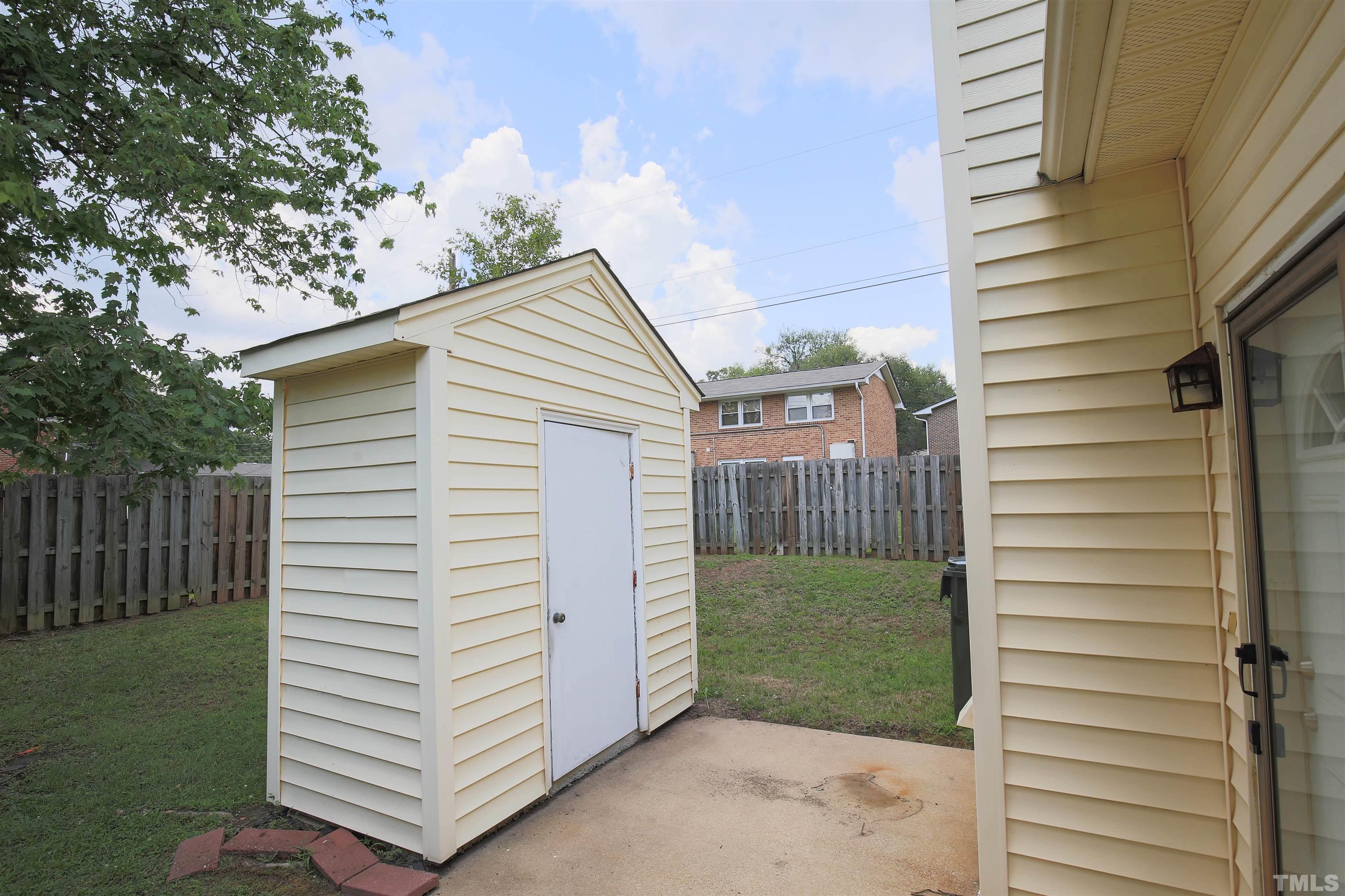 1507 Clermont Road, Unit T23 Durham, NC 27713 - Photo 20 of 24 a view of a house with a yard