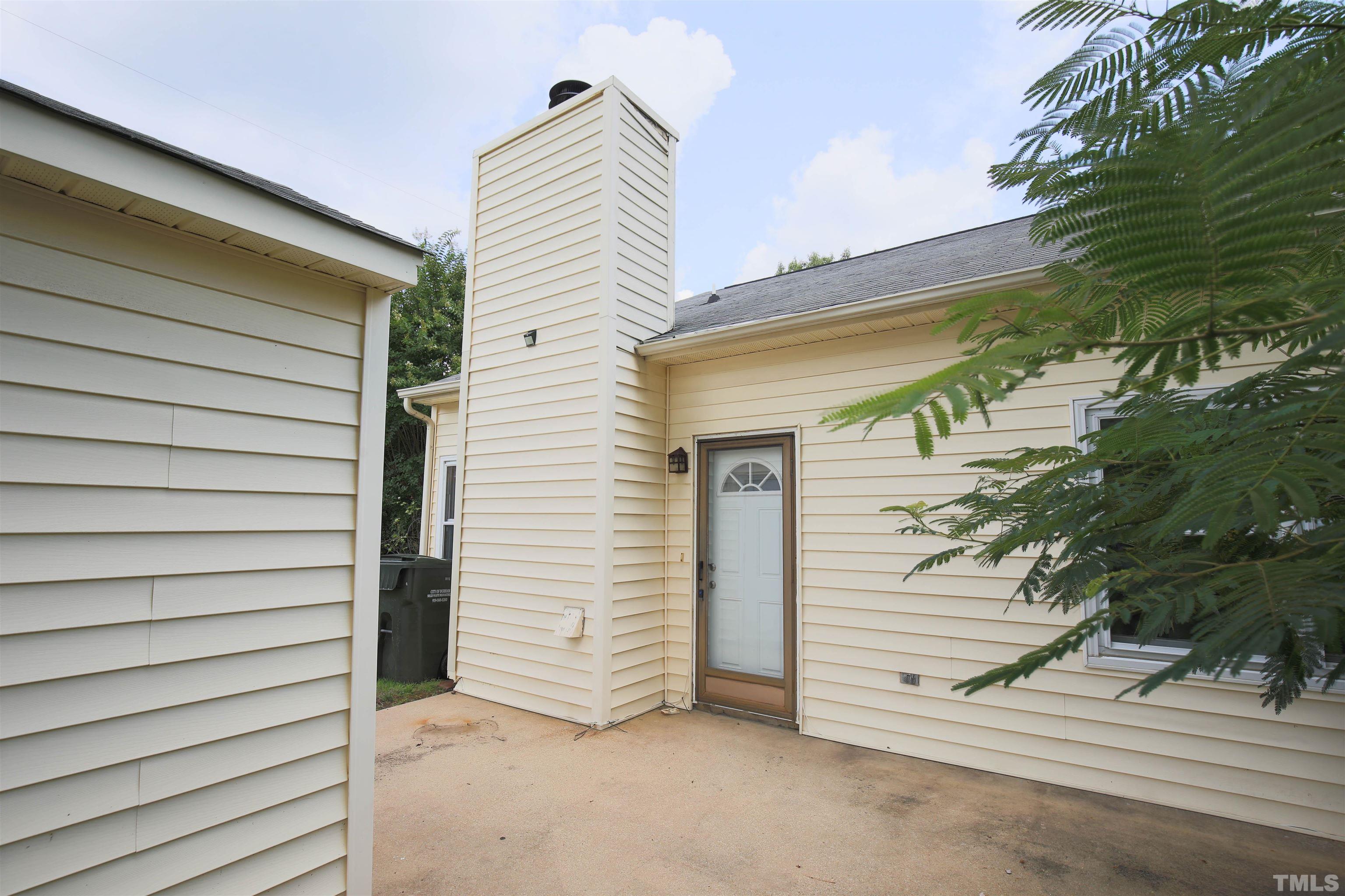 1507 Clermont Road, Unit T23 Durham, NC 27713 - Photo 24 of 24 a view of a house with a door and wooden walls