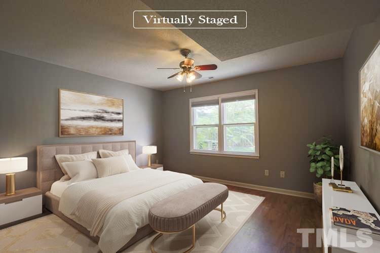 1507 Clermont Road, Unit T23 Durham, NC 27713 - Photo 8 of 24 a bedroom with a large bed and a window