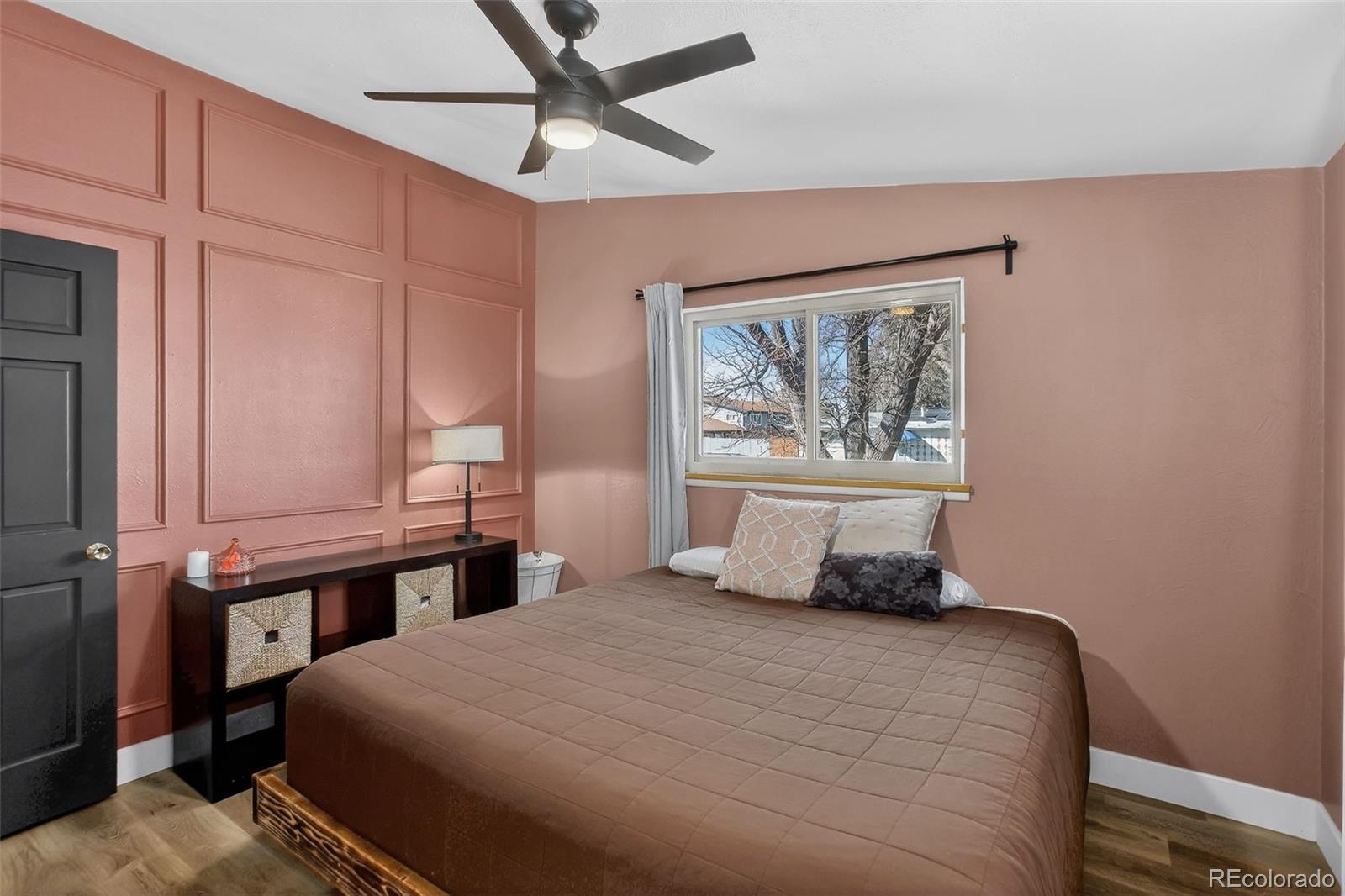 490 Quentin Street Aurora, CO 80011 - Photo 17 of 38 a bedroom with a large bed and a window