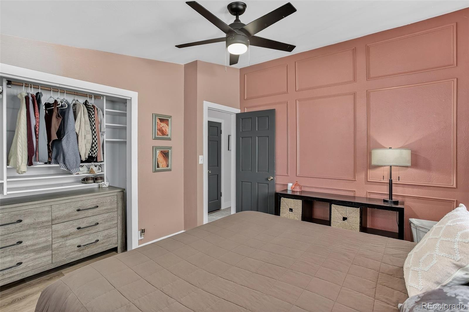 490 Quentin Street Aurora, CO 80011 - Photo 18 of 38 a bedroom with a bed and a closet