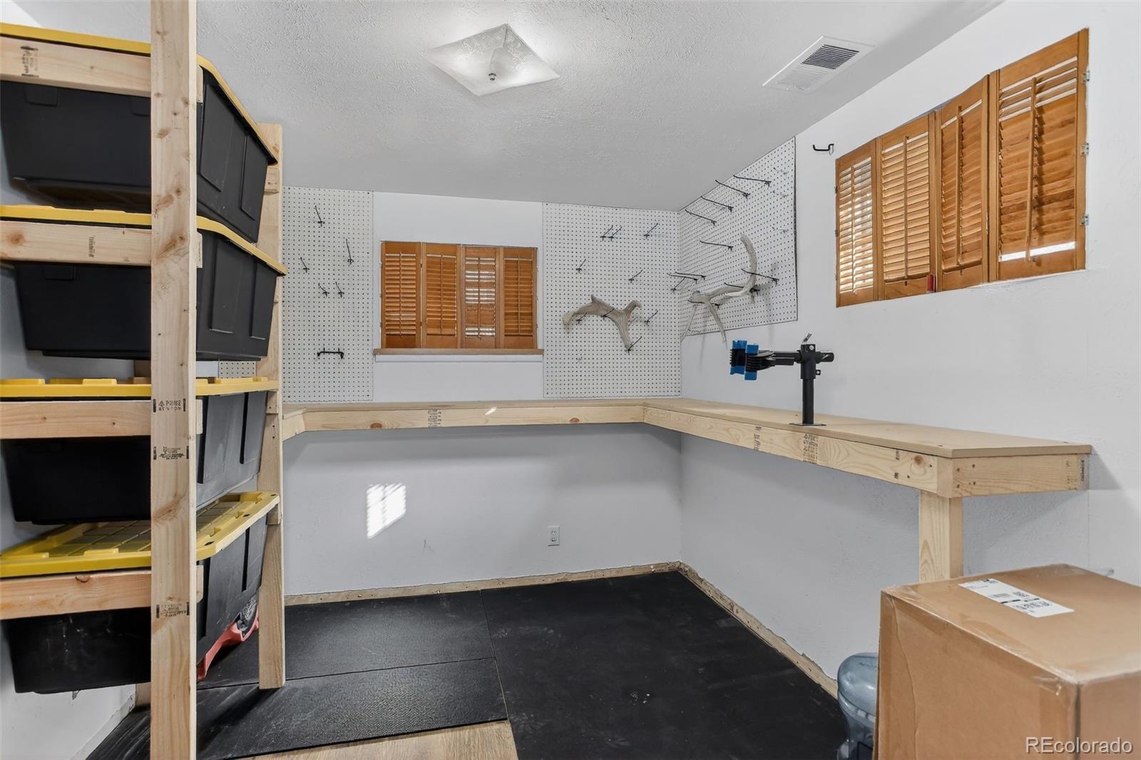 490 Quentin Street Aurora, CO 80011 - Photo 31 of 38 a view of storage and utility room