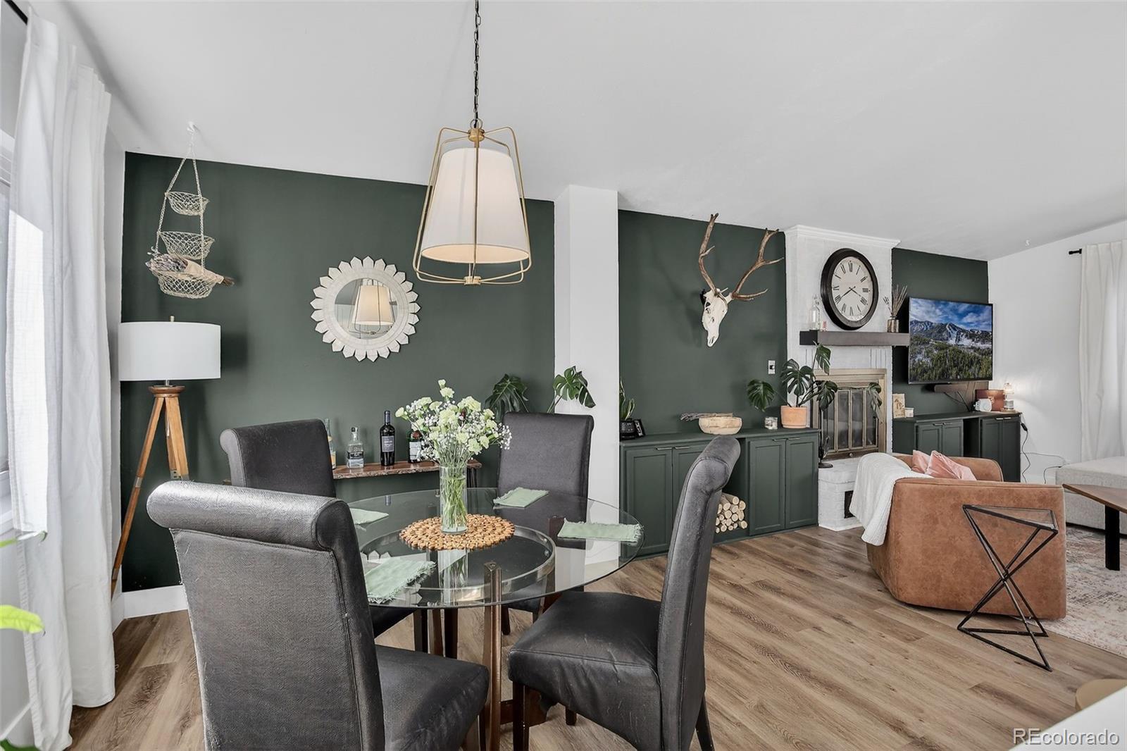 490 Quentin Street Aurora, CO 80011 - Photo 10 of 38 a view of a dining room with furniture and wooden floor