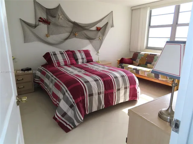 a bathroom with a granite countertop sink a toilet and mirror