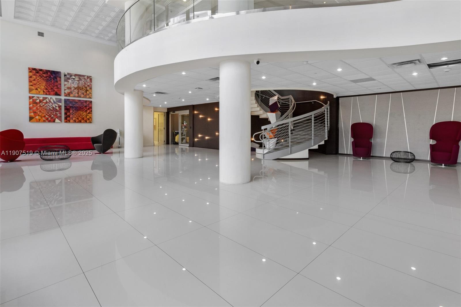 5701 Collins Avenue, Unit 304 Miami Beach, FL 33140 - Photo 26 of 42 a lobby with furniture and a ceiling fan