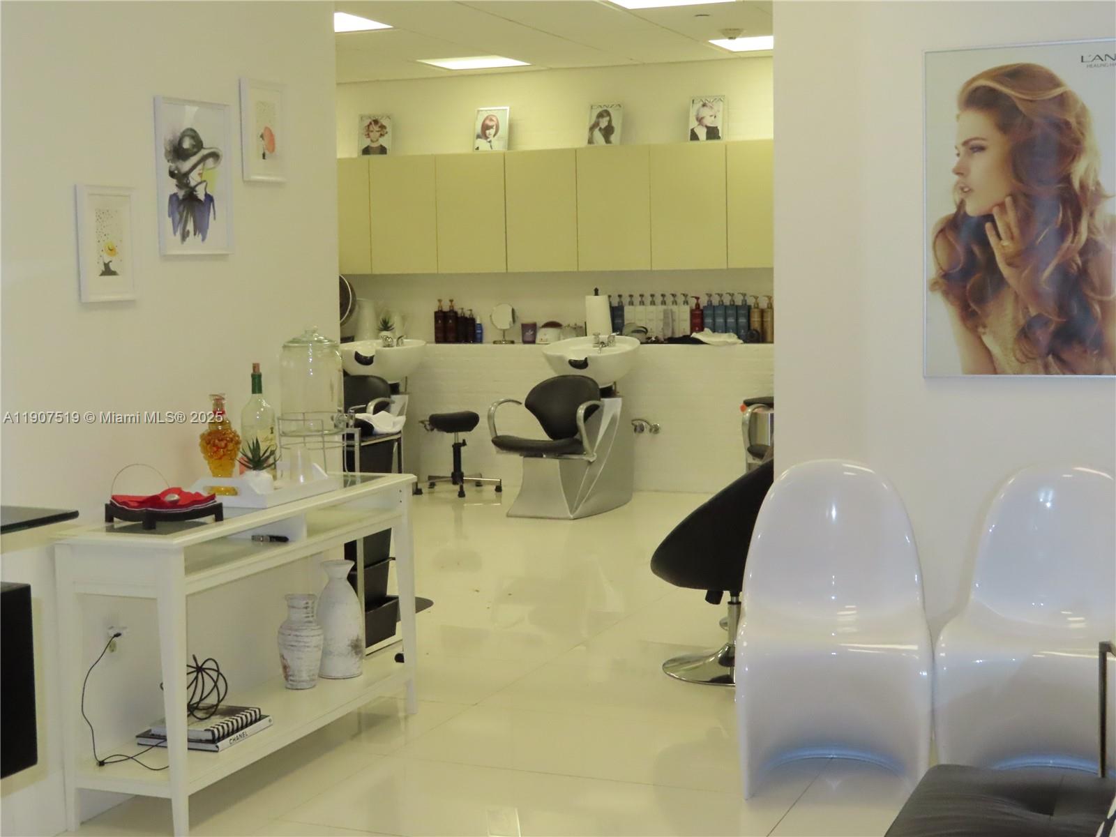 5701 Collins Avenue, Unit 304 Miami Beach, FL 33140 - Photo 38 of 42 a bathroom with a sink and mirror