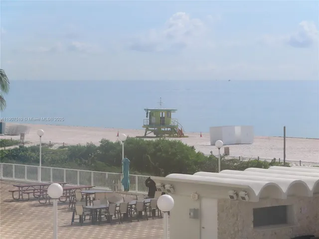 a living room with furniture and a lamp