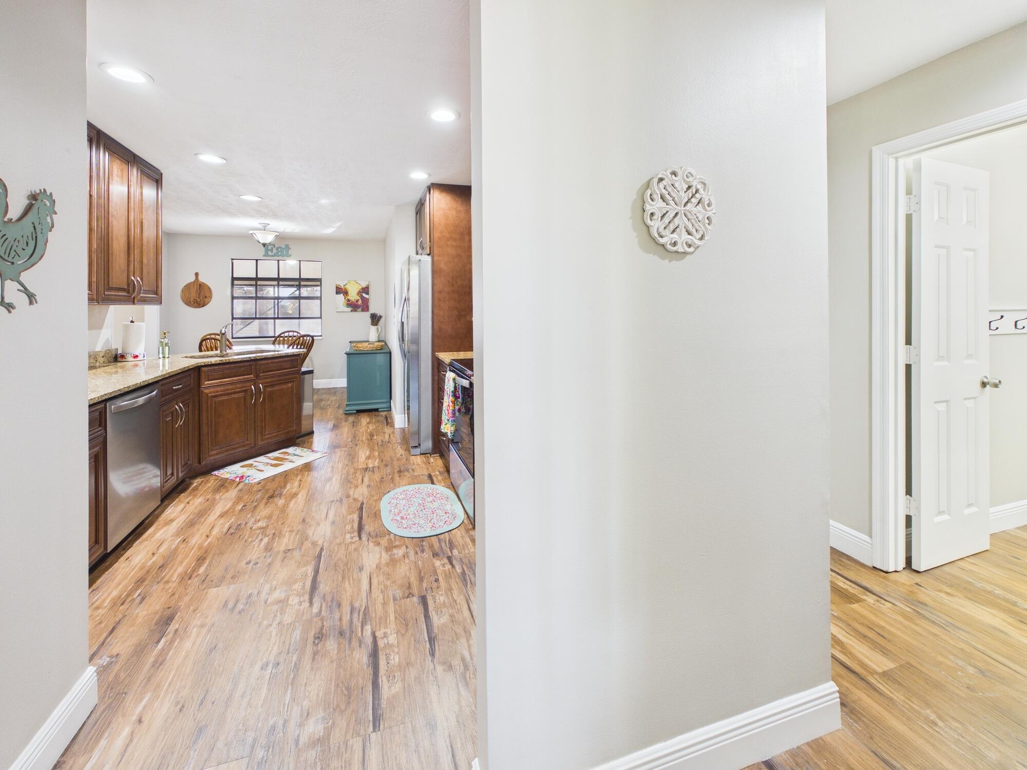 755 Southwest 85th Avenue Okeechobee, FL 34974 - Photo 18 of 99 a kitchen with stainless steel appliances granite countertop a refrigerator and a stove top oven