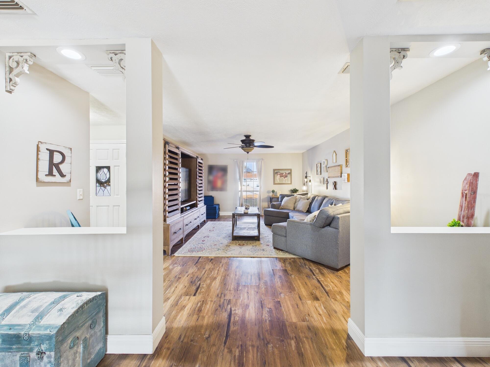 755 Southwest 85th Avenue Okeechobee, FL 34974 - Photo 27 of 99 a living room with furniture and a wooden floor