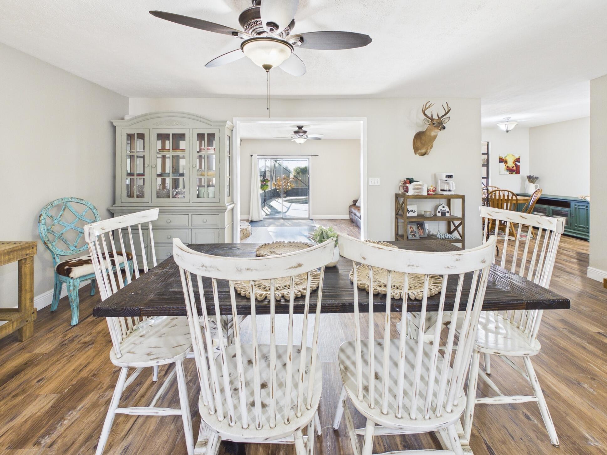 755 Southwest 85th Avenue Okeechobee, FL 34974 - Photo 31 of 99 a view of a dining room with furniture and wooden floor