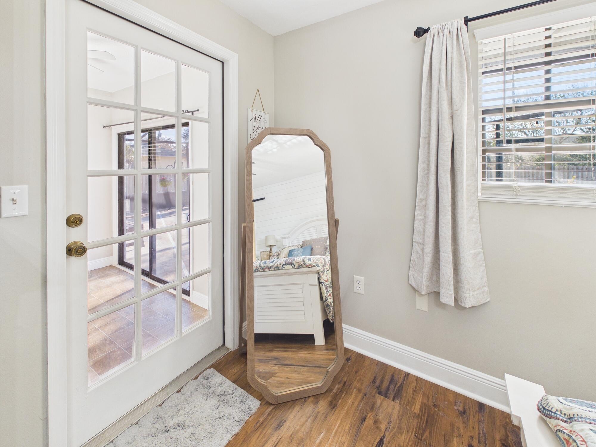 755 Southwest 85th Avenue Okeechobee, FL 34974 - Photo 45 of 99 a view of a hallway with wooden floor and a living room