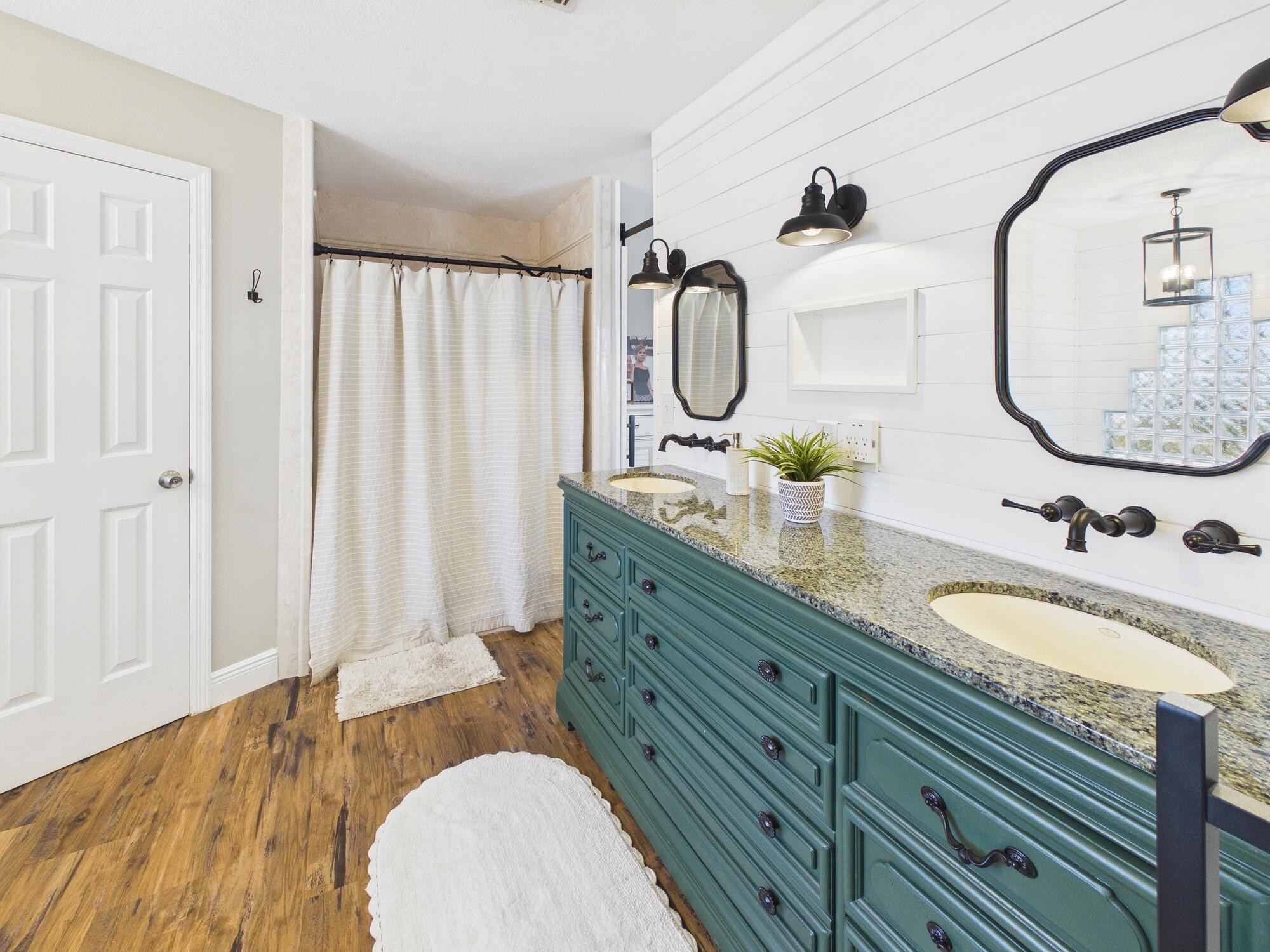 755 Southwest 85th Avenue Okeechobee, FL 34974 - Photo 55 of 99 a bathroom with a granite countertop sink and a mirror