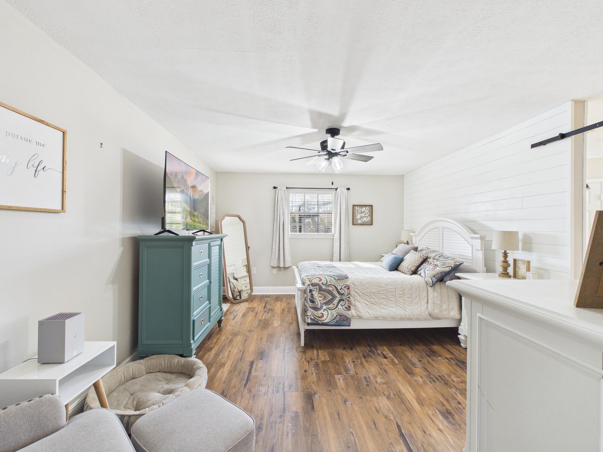 755 Southwest 85th Avenue Okeechobee, FL 34974 - Photo 58 of 99 a bedroom with furniture and a large mirror