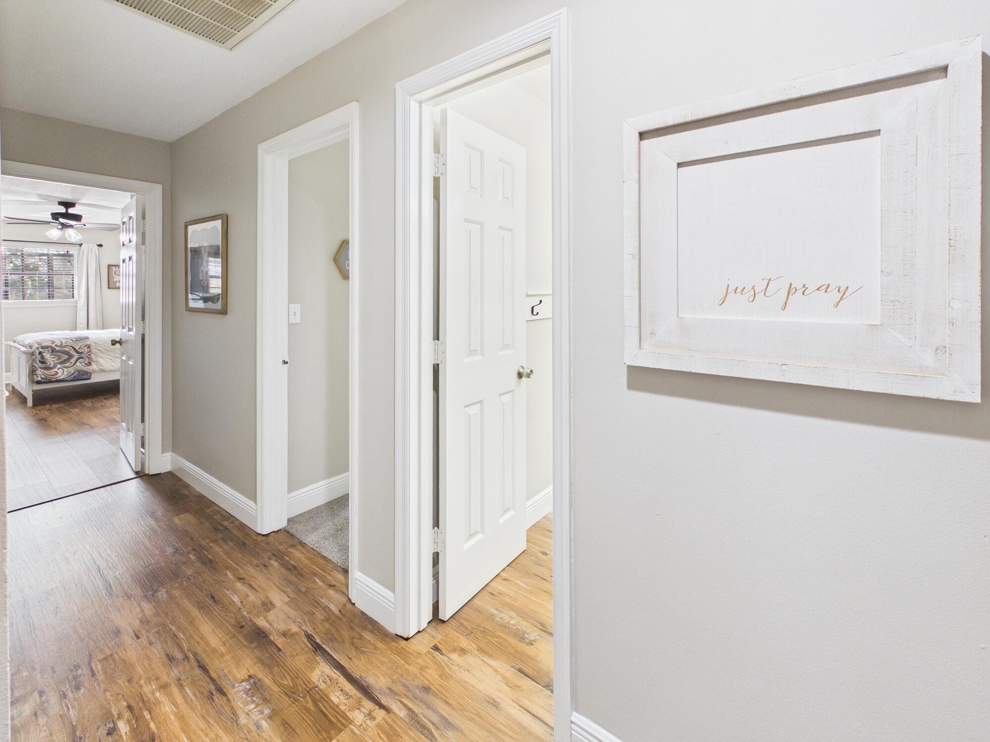 755 Southwest 85th Avenue Okeechobee, FL 34974 - Photo 62 of 99 a view of a hallway with wooden floor and a cabinet